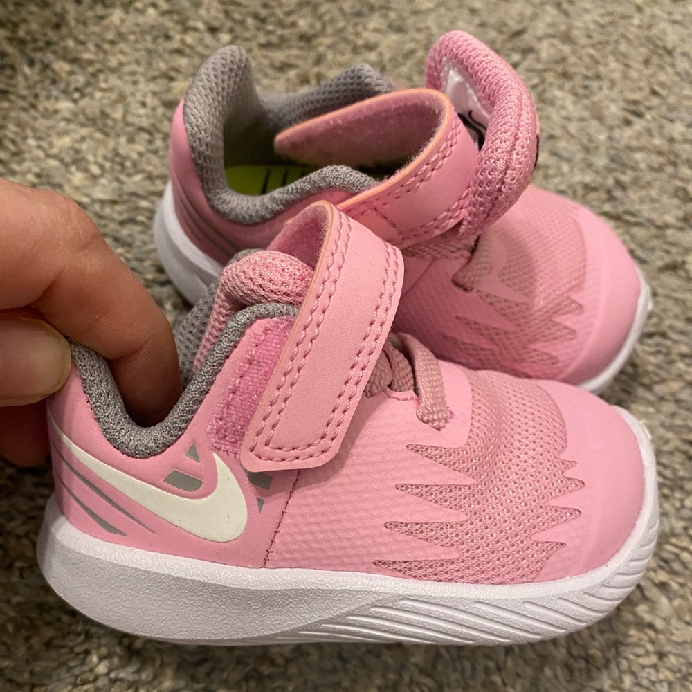 Pink Nike shoes size 2c